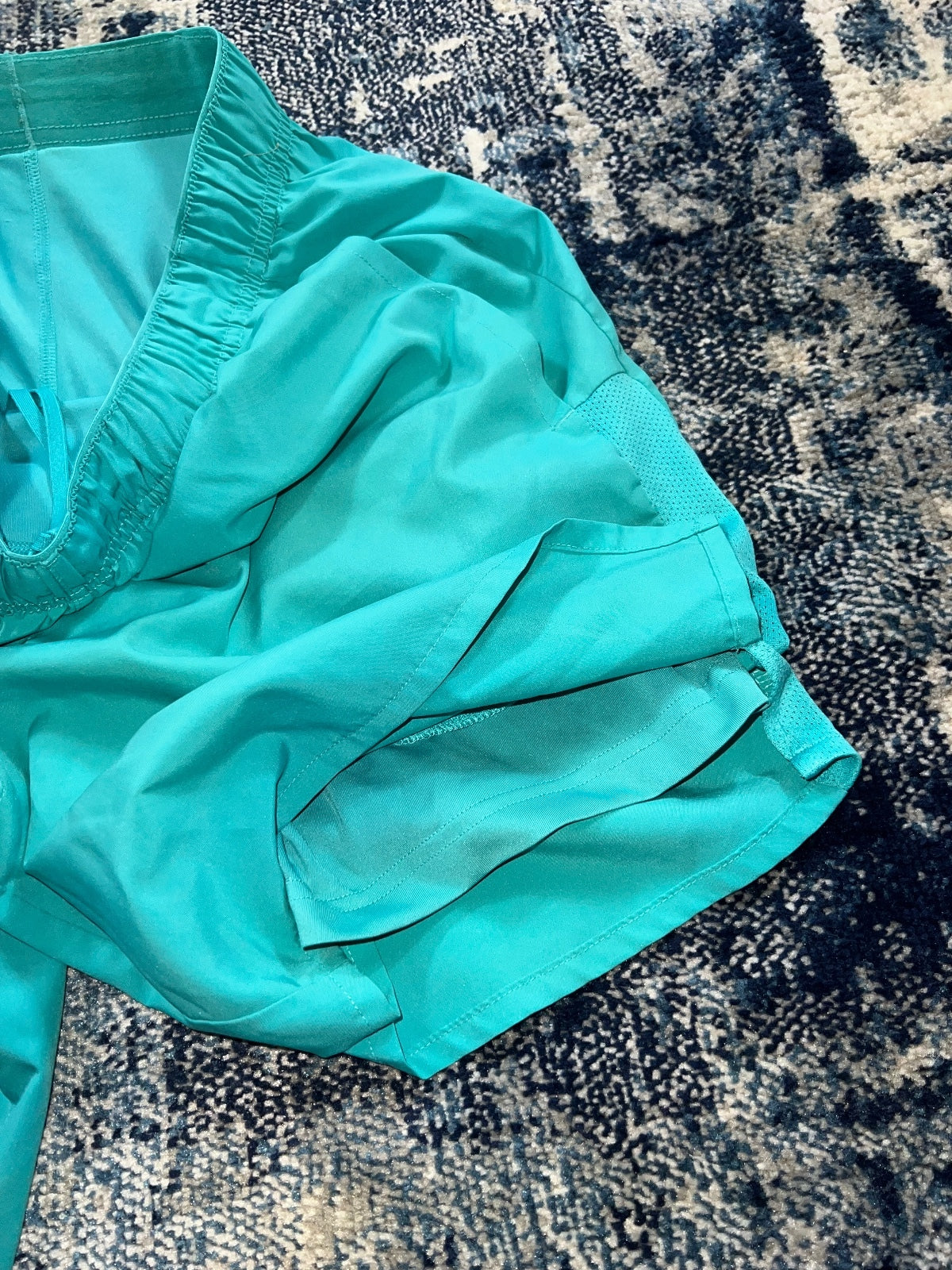 Nike Running Challenger 2 in 1 Shorts – Turquoise, Men's Medium in Turquoise, men's Medium – detail view