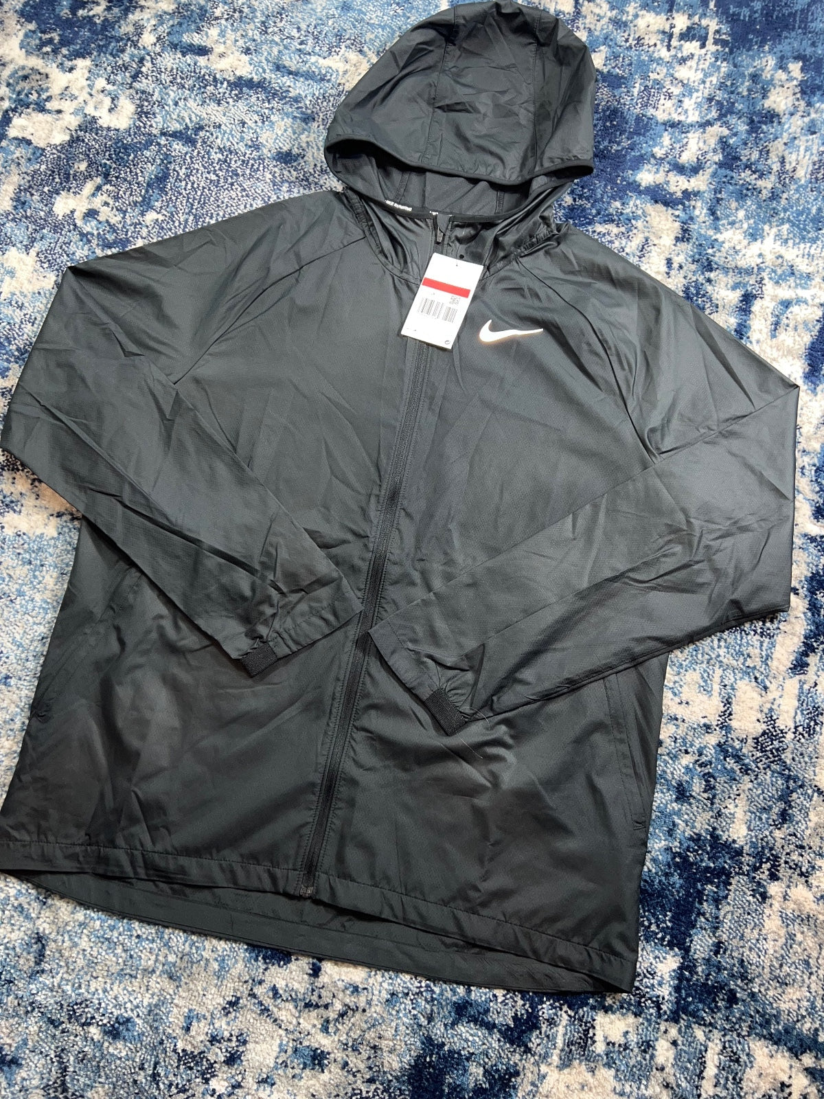 Nike Essentials Dri Fit Windrunner Jacket – Black, Men's Large in Black, men's Large – detail view