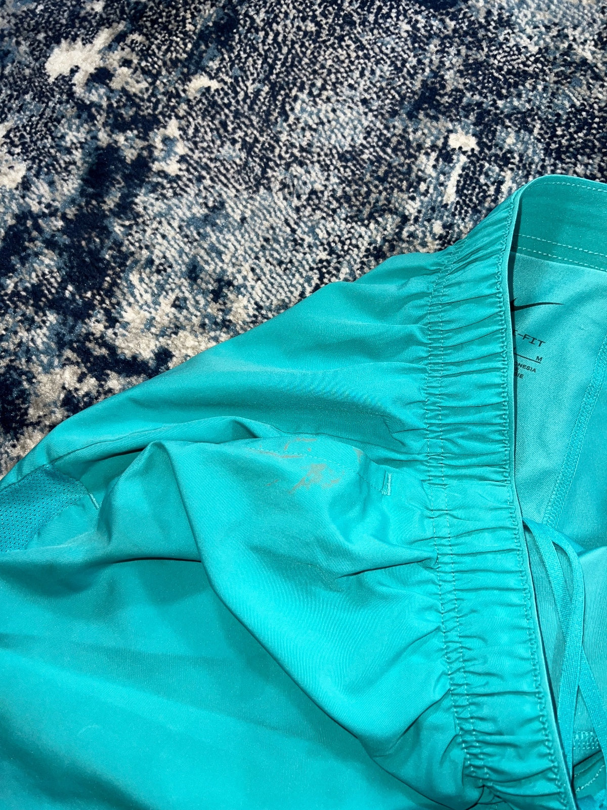 Nike Running Challenger 2 in 1 Shorts – Turquoise, Men's Medium in Turquoise, men's Medium – detail view