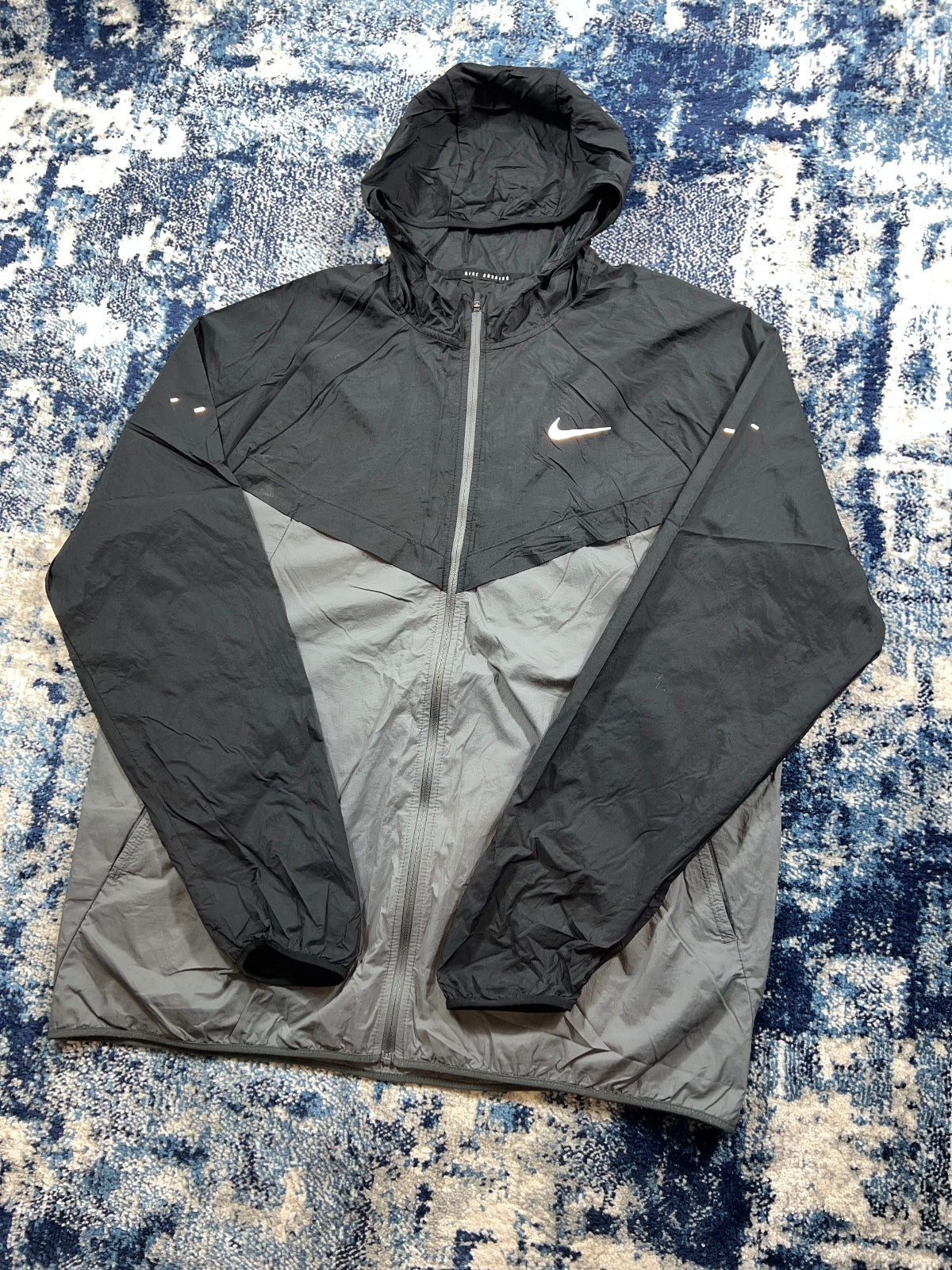 Nike Stride Dri Fit Windrunner Jacket – Black, Men's Large in Black, men's Large – detail view