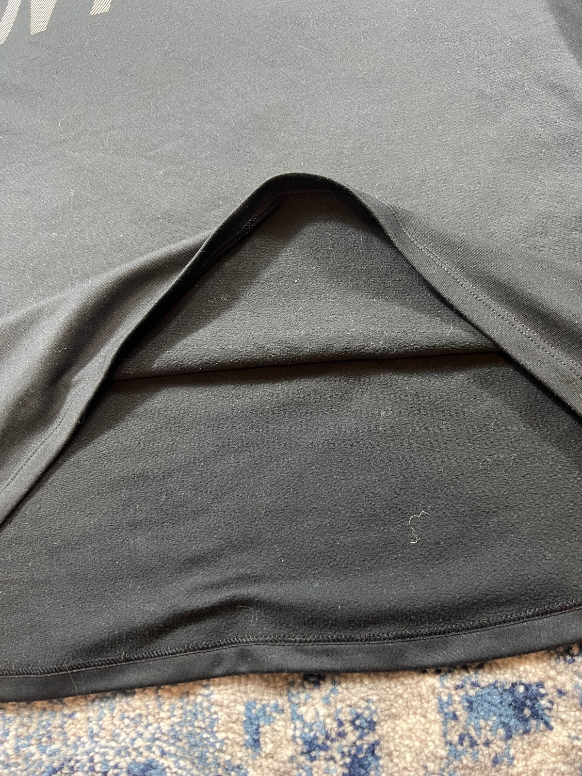 Nike Running Division 2 in 1 Jumper – Black, Women's Small in Black, men's Small – detail view