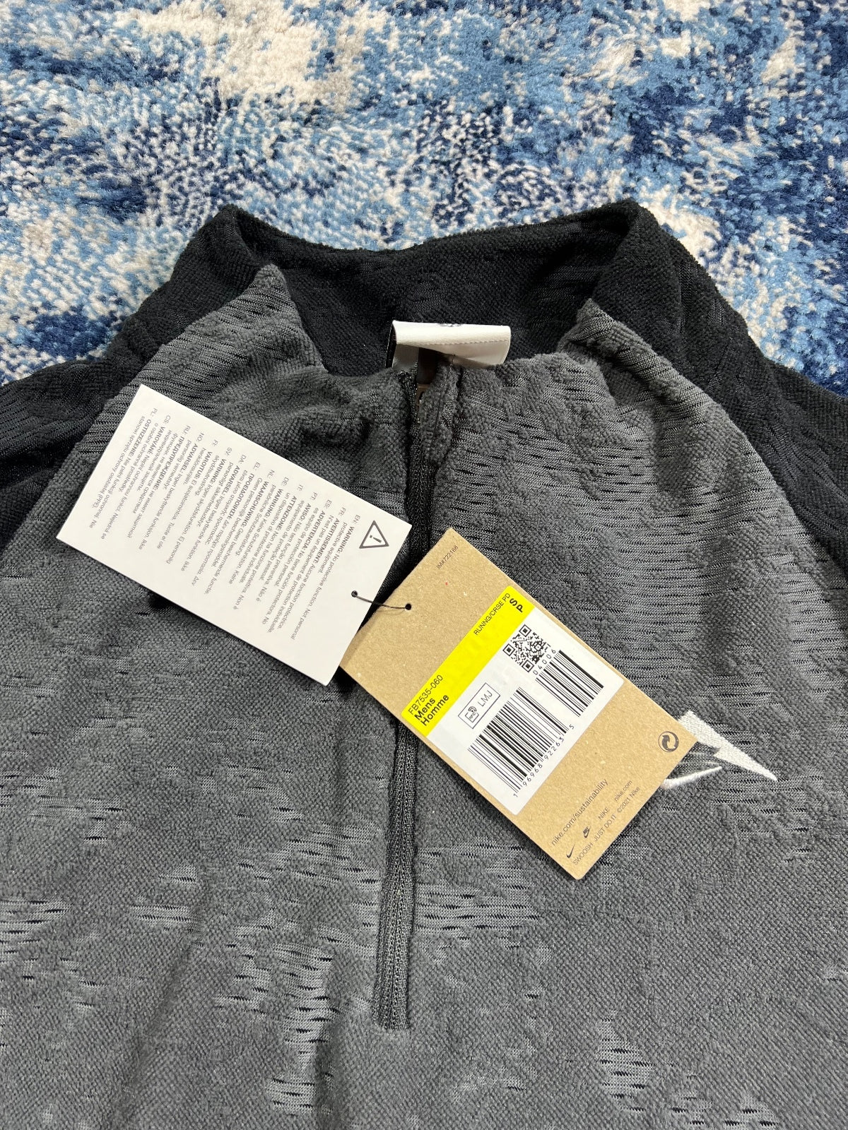 Nike Trail Dri Fit Running Fleece Top – Black, Men's Extra Small in Black, men's Extra Small – detail view