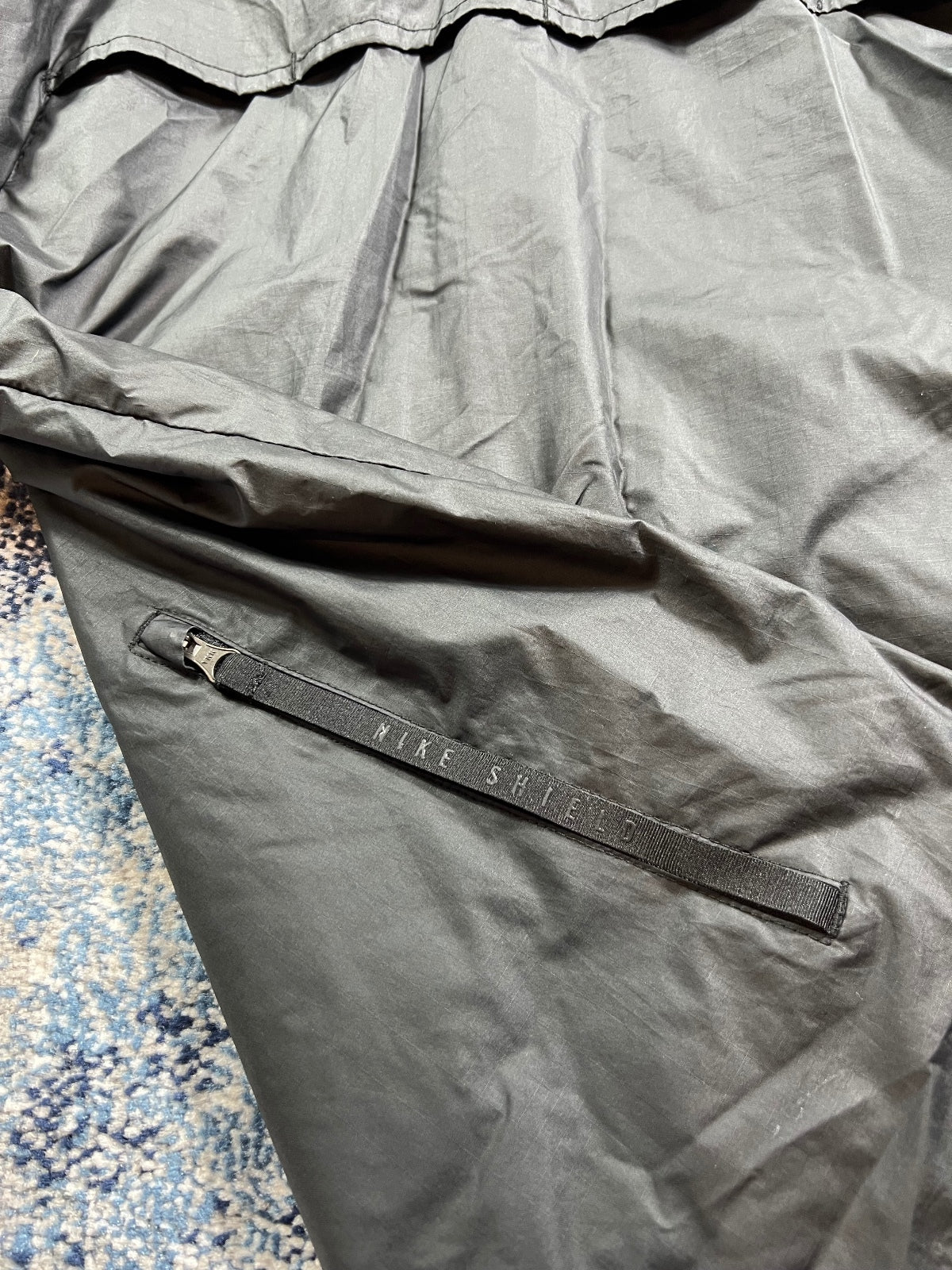 Nike ShieldRunning Storm Fit Running Jacket – Black, Men's Small in Black, men's Small – detail view