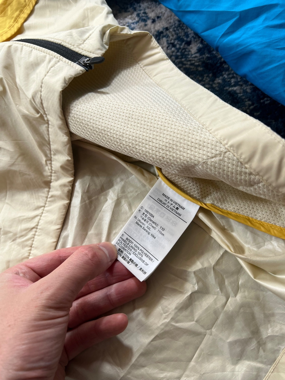 Nike Trail Storm Fit Windrunner Jacket – Yellow / Blue, Men's XL in Yellow / Blue, men's XL – detail view