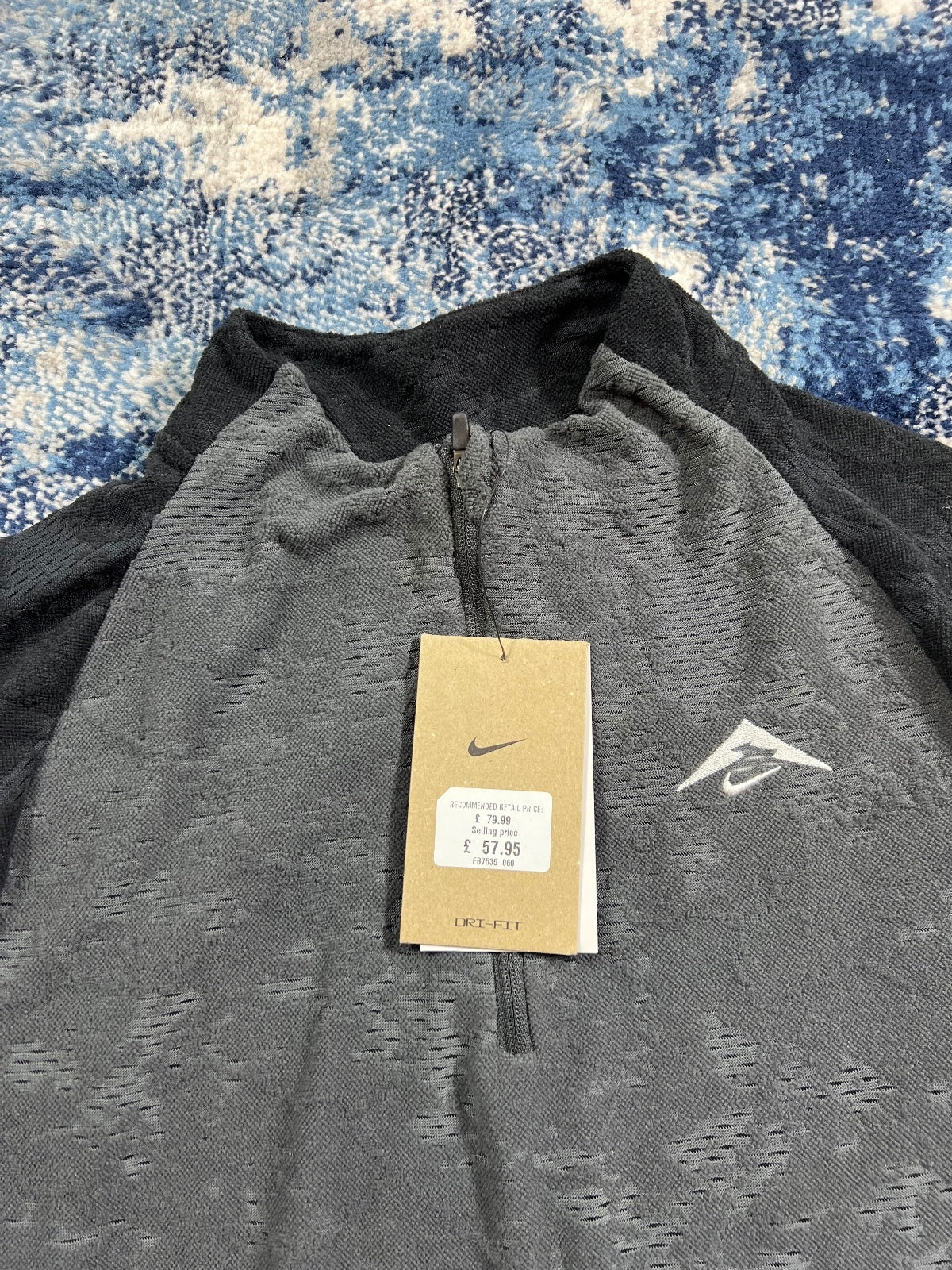 Nike Trail Dri Fit Running Fleece Top – Black, Men's Extra Small in Black, men's Extra Small – detail view