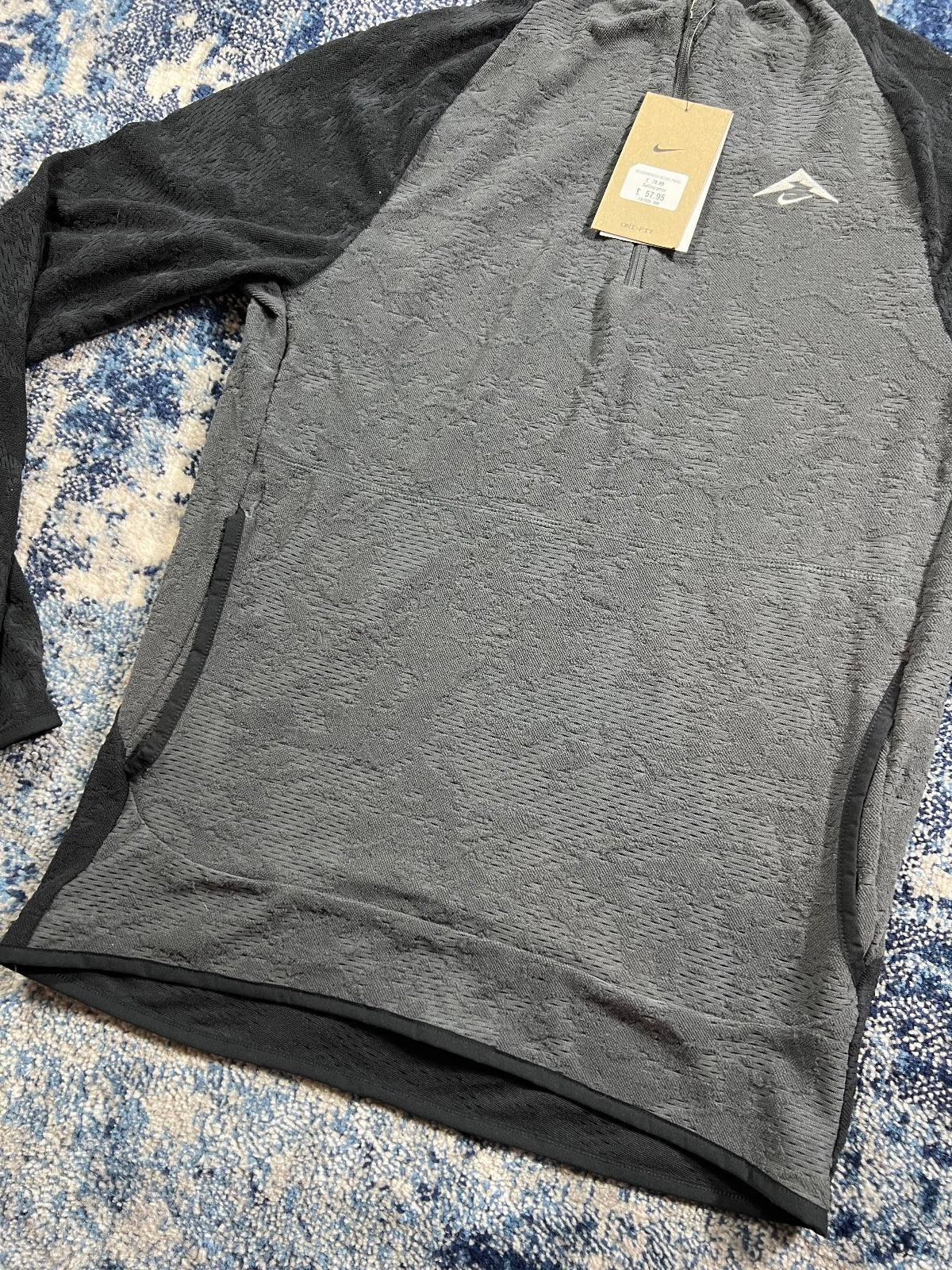 Nike Trail Dri Fit Running Fleece Top – Black, Men's Extra Small in Black, men's Extra Small – detail view