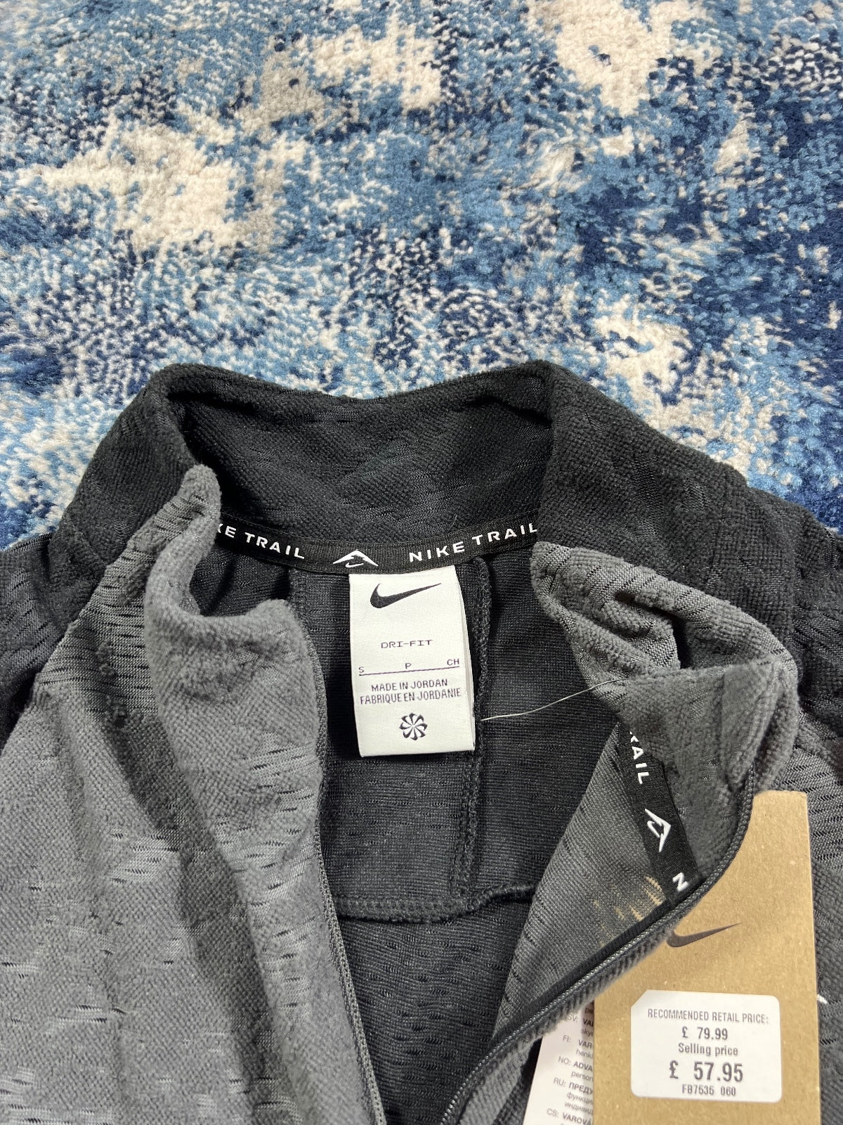 Nike Trail Dri Fit Running Fleece Top – Black, Men's Extra Small in Black, men's Extra Small – detail view