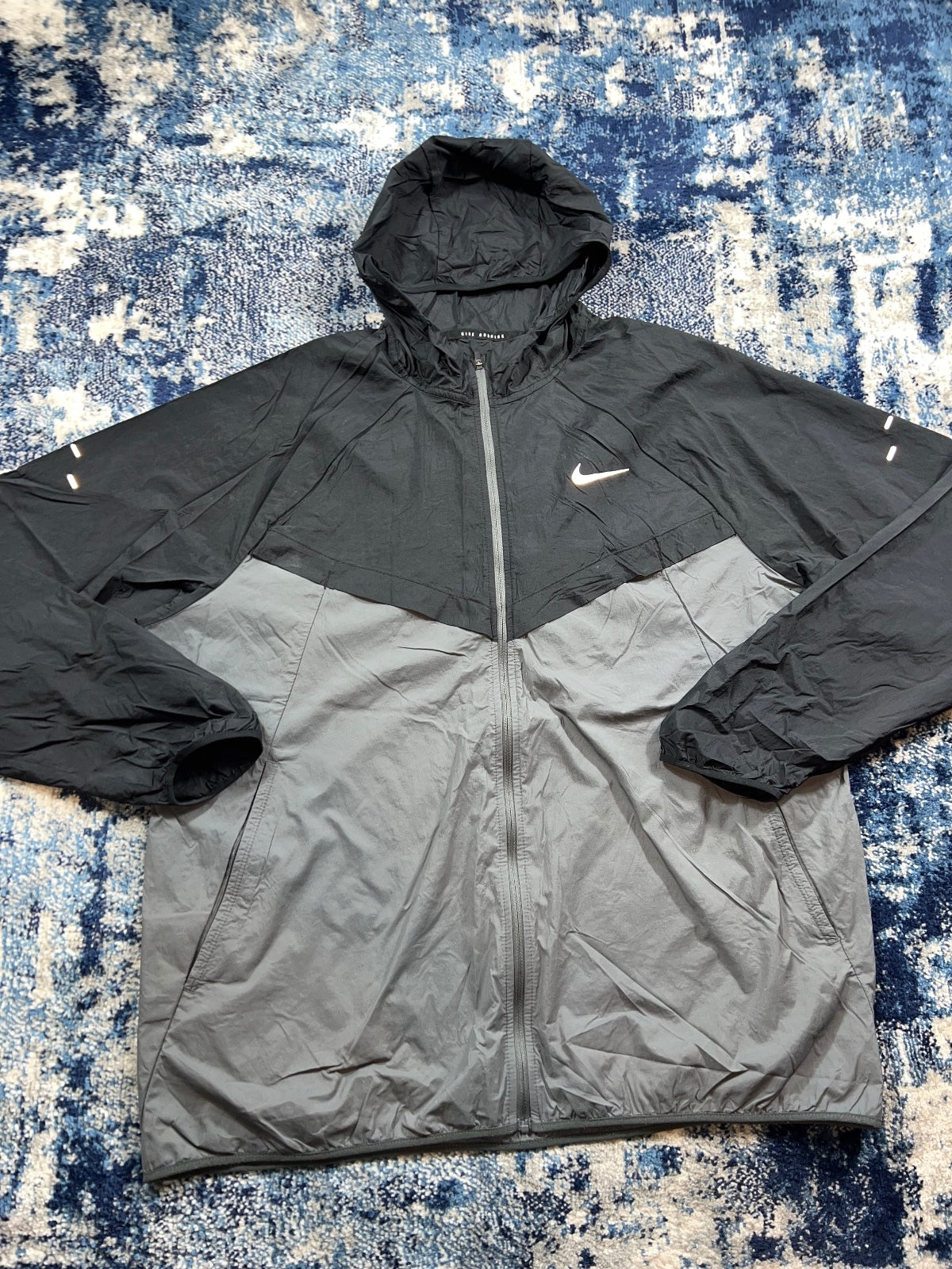 Nike Stride Dri Fit Windrunner Jacket – Black, Men's Large in Black, men's Large – detail view