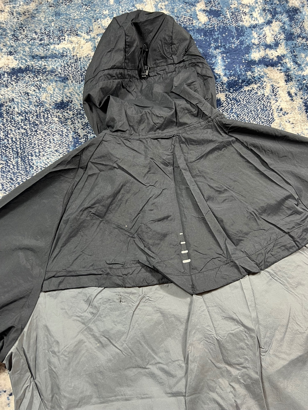 Nike Stride Dri Fit Windrunner Jacket – Black, Men's Large in Black, men's Large – detail view
