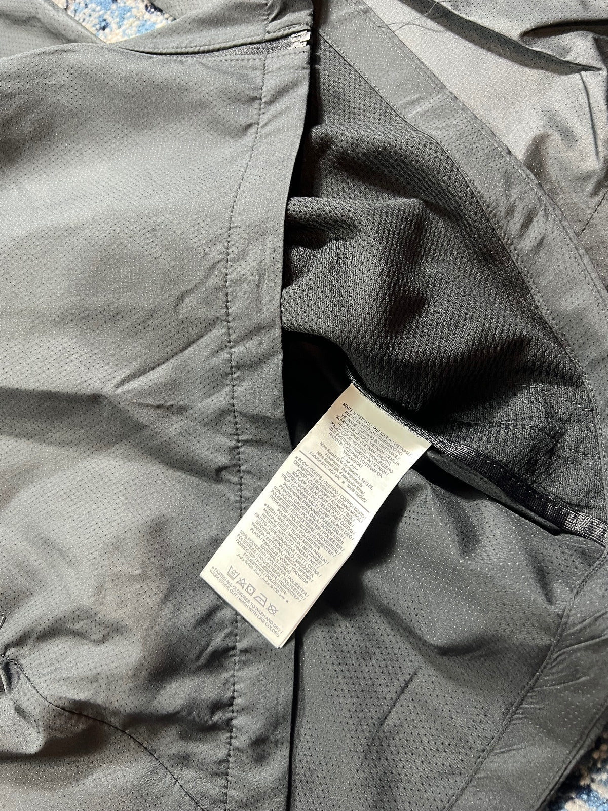 Nike Essentials Dri Fit Windrunner Jacket – Black, Men's Large in Black, men's Large – detail view